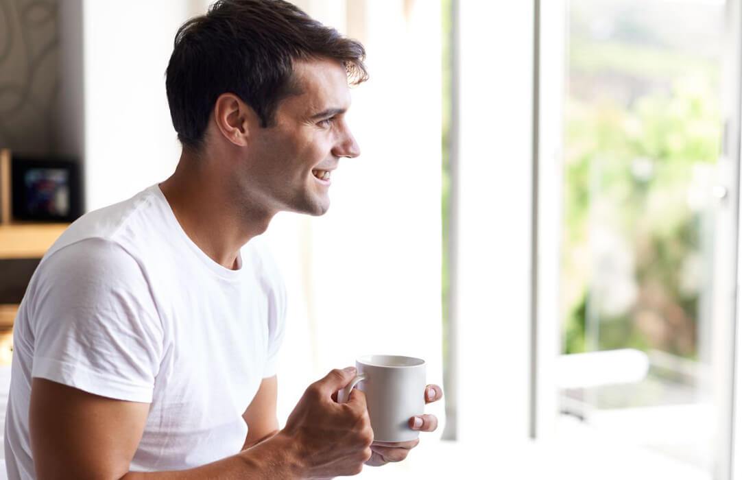 Man said. Man Drink Coffee in Dark Room. Man Drink Coffee near of the Computer. Man drinking Coffee in Cafe. Man Drink Coffee in Dark Room near of the Computer.