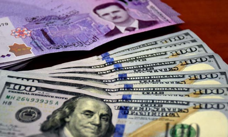 المالية السورية توضح قصة تصريف المئة دولار على الحدود