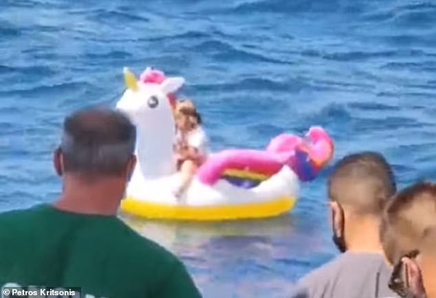 32340358-8660379-The_child_floated_half_a_mile_away_from_the_town_of_Antirrio_in_-a-87_1598316754518.jpg